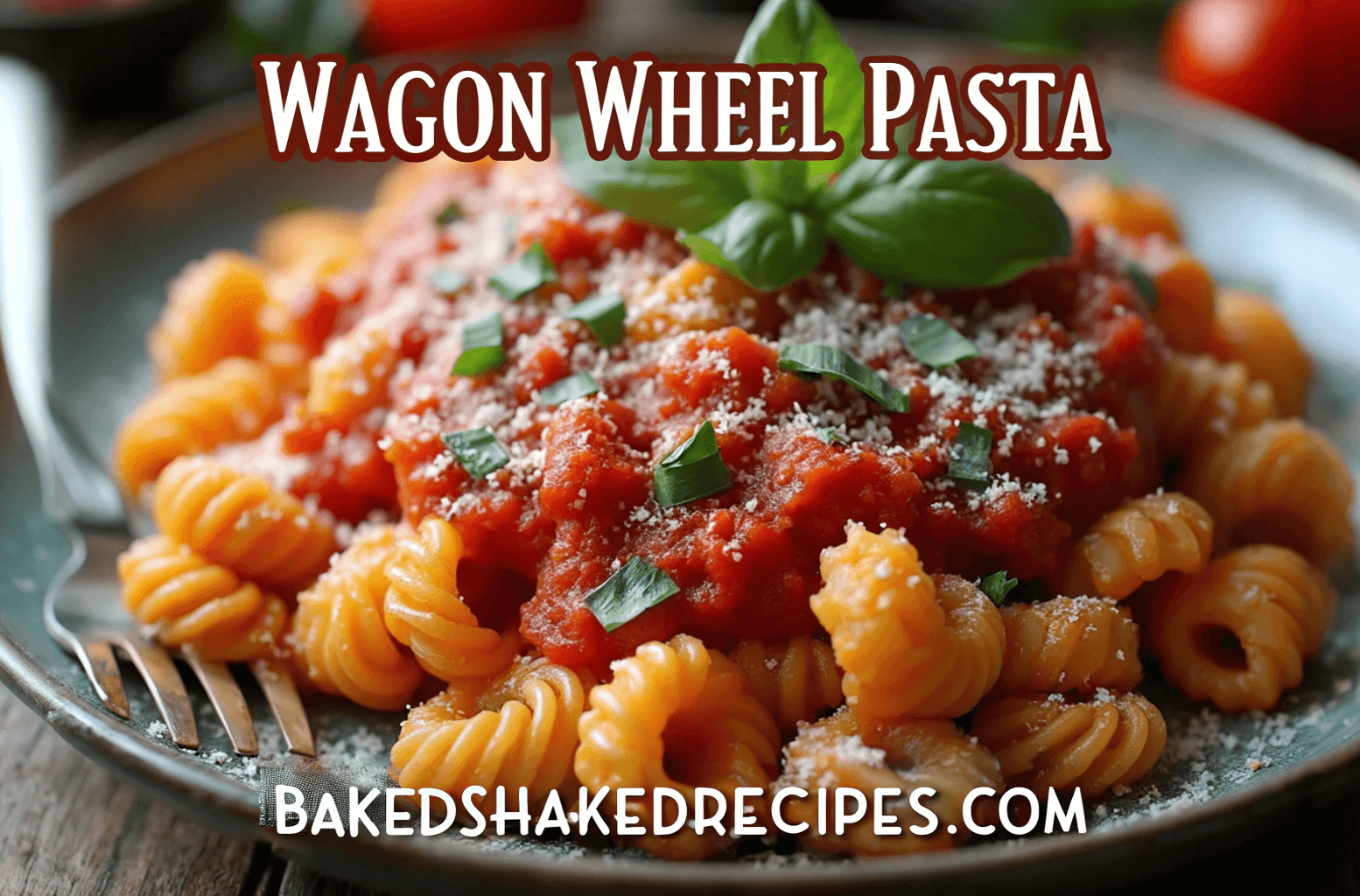 A plate of wagon wheel pasta with tomato sauce, grated Parmesan cheese, and fresh basil on top, served on a rustic wooden table.